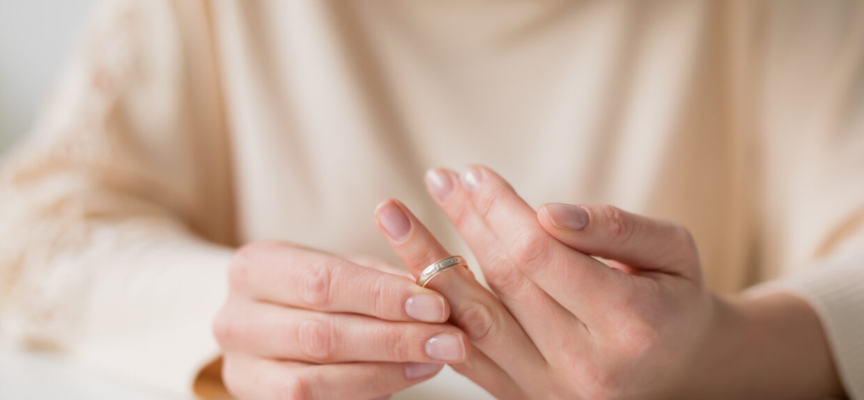 Woman removing wedding ring